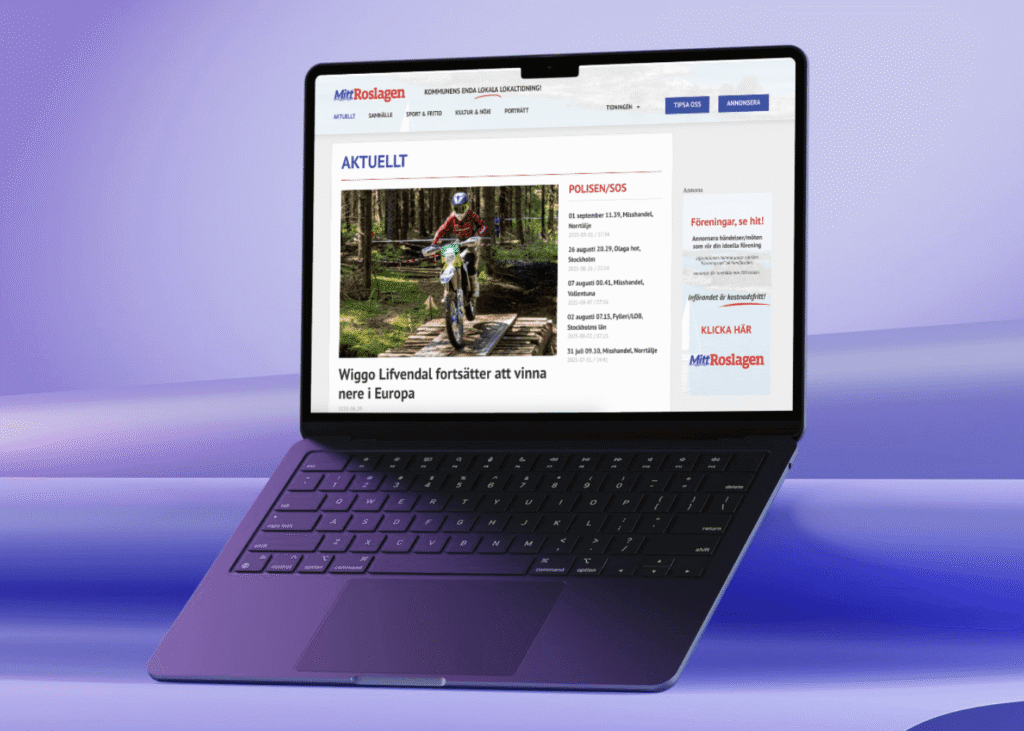 En bärbar dator visar en svensk nyhetswebbplats med en rubrik om Wiggo Löfvendals fortsatta motocrossframgångar i Europa, med en Ecobox-annons bredvid ett foto av en förare på en dirt bike i ett skogslopp.